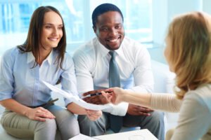 Insurance agent helping clients compare local insurance plans and coverage options